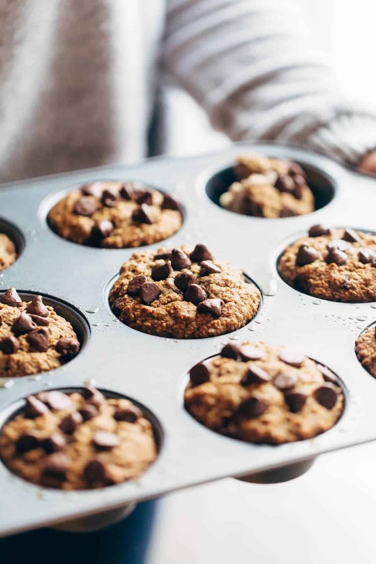 Banana bread muffins topped with chocolate chips.