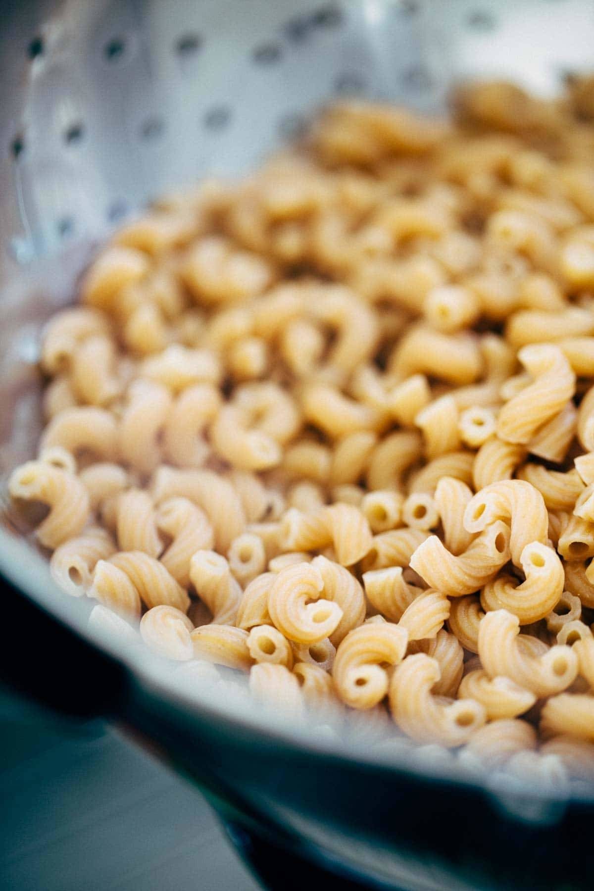 Noodles in a strainer.