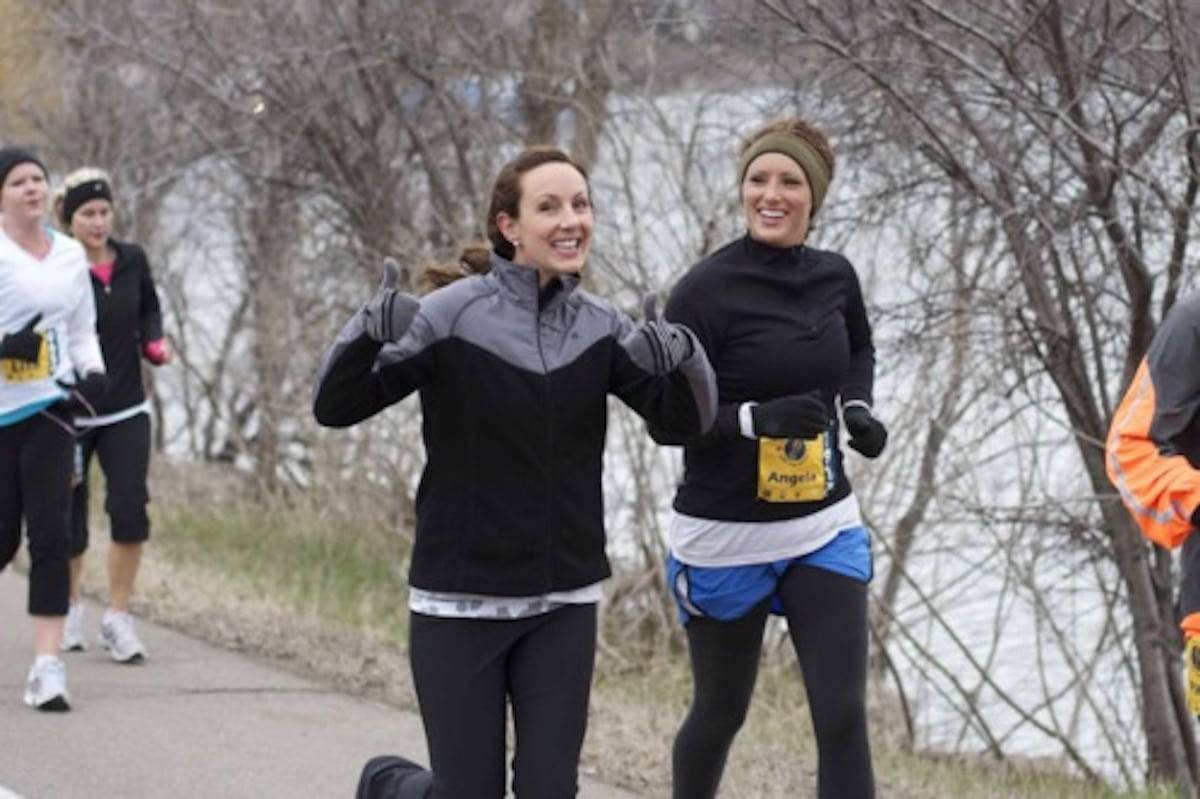 Two women running a race.