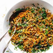Sweet Potato Noodle Salad in serving bowl with spoons.