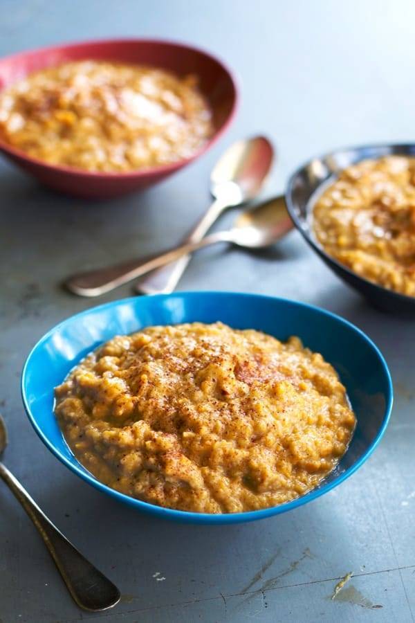 Sweet Potato Lentils in a blue bowl with spoons.