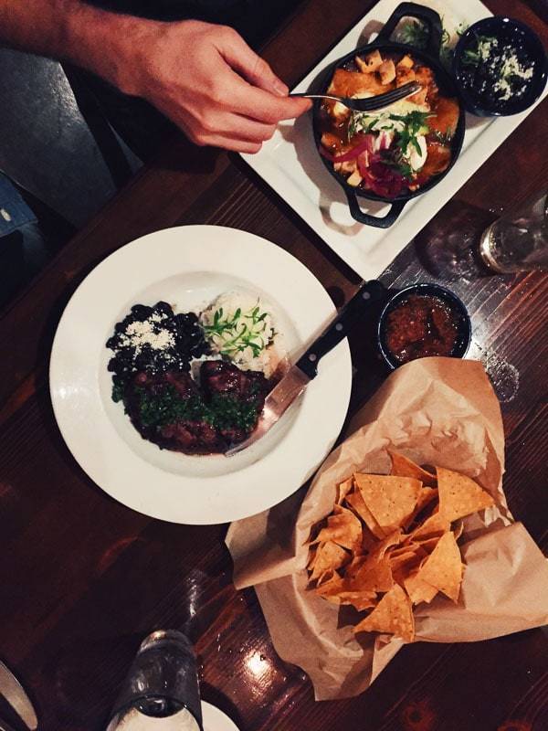 Table with plates of food.