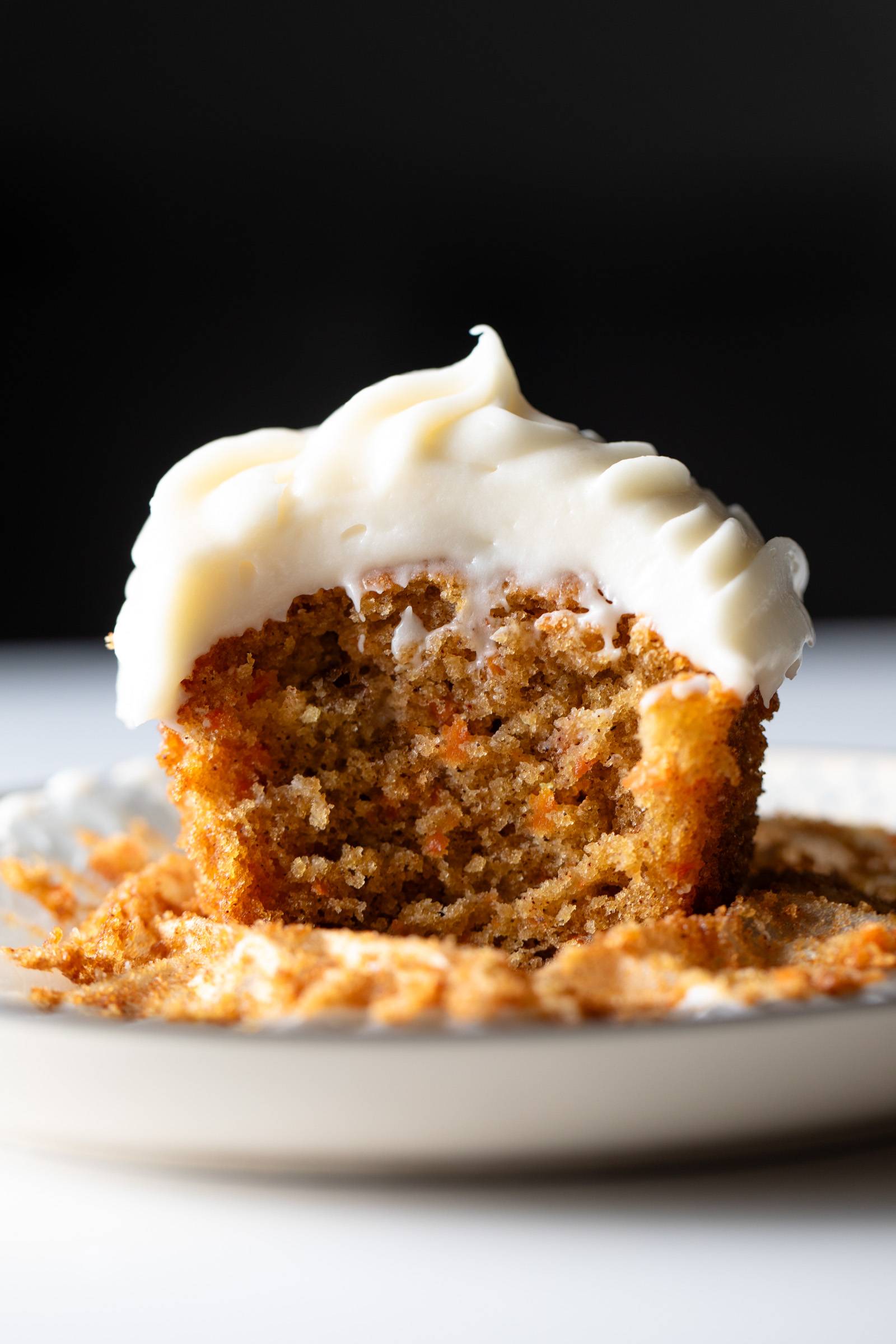 Carrot cake cupcake with cream cheese frosting.