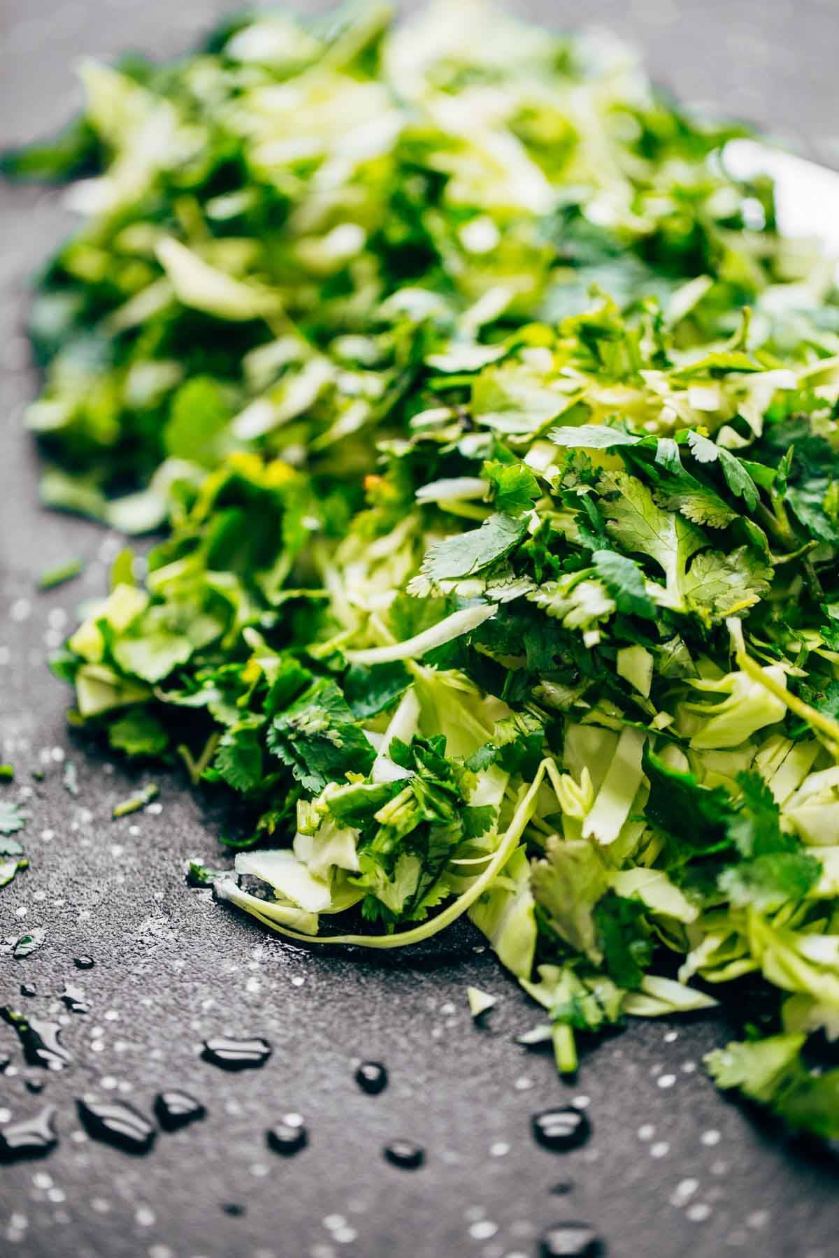 Herbs on a cutting board.