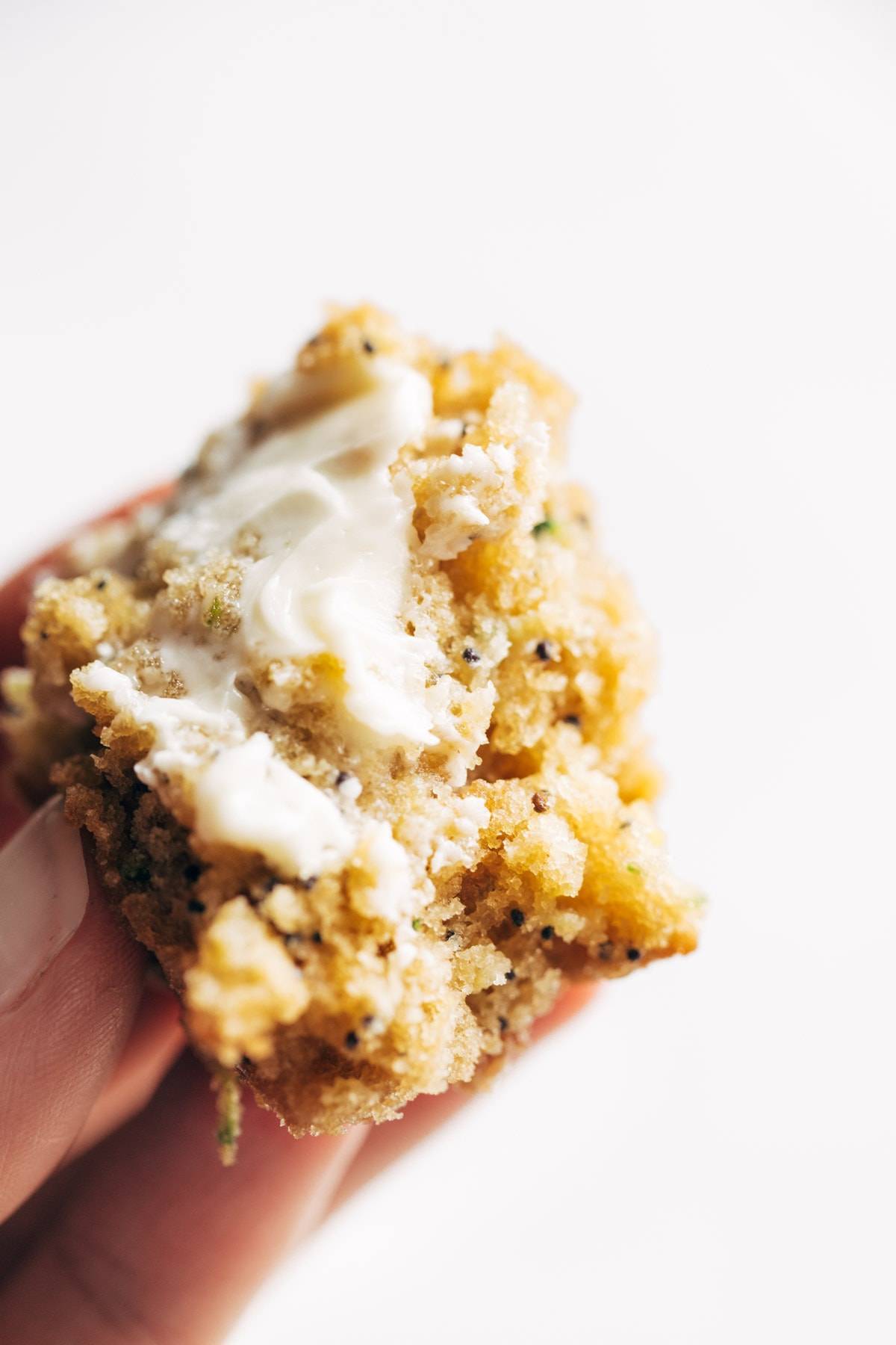 Butter on lemon poppyseed zucchini muffin.