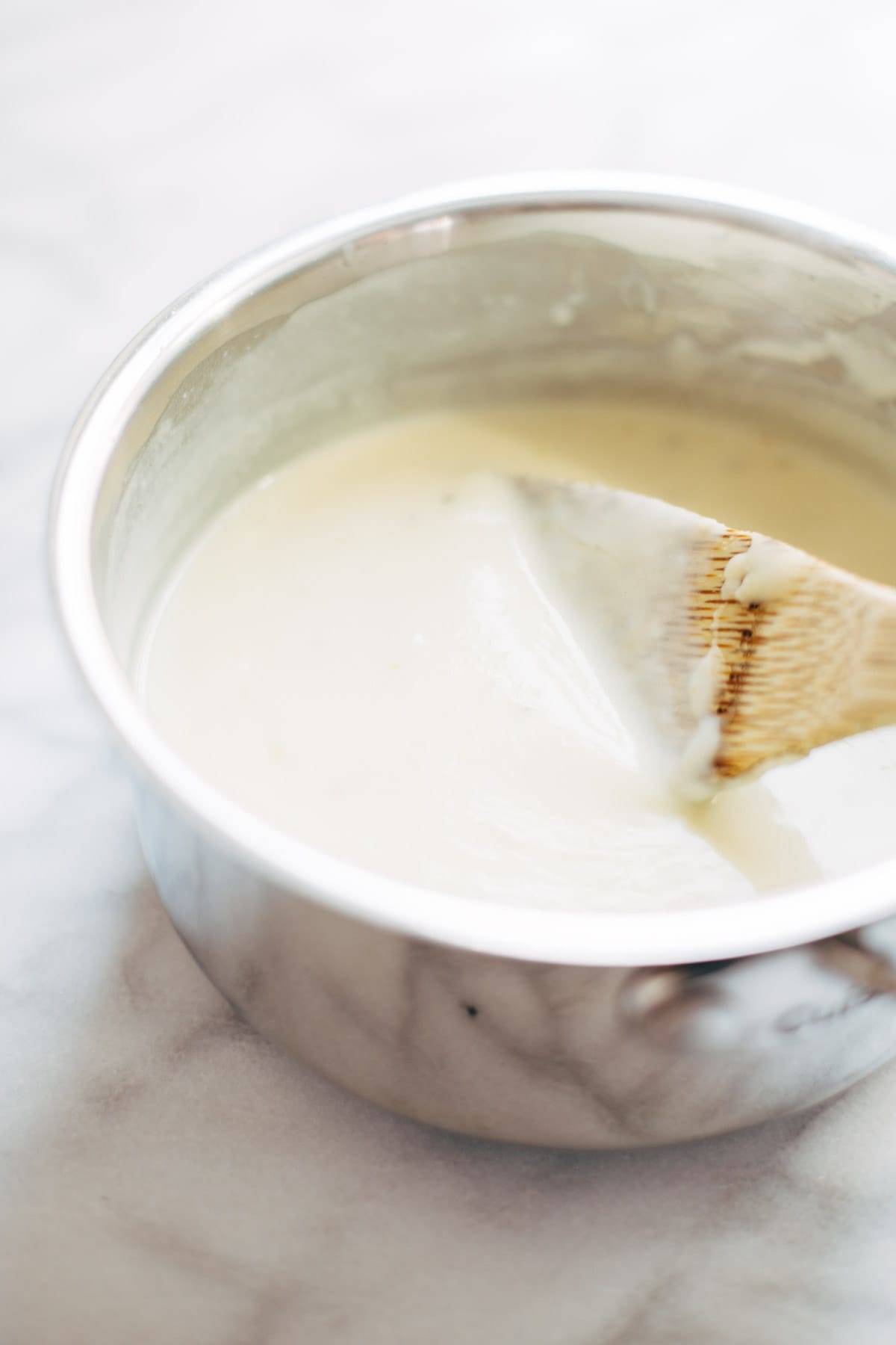 Spicy Lentil Nachos with Three Cheese Sauce - you will not believe how good these are! Saucy filling with a velvety homemade cheese sauce. Vegetarian. | pinchofyum.com